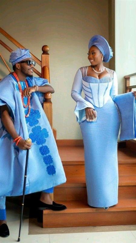 A traditional Nigerian bridal look featuring a basque waist Aso Oke gown paired with coordinated groom attire, styled for a modern African luxury wedding.